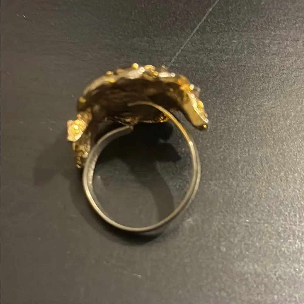 Vintage Gold Flower ring with purple center  adjustable starting at size 7 1/2